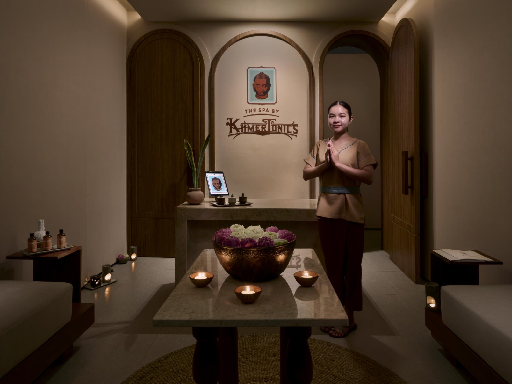 A member of staff welcomes guests at the spa reception.