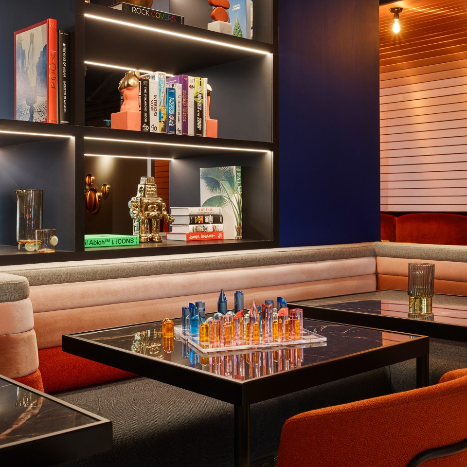 Living Space with colourful couches and decorations in the shelves