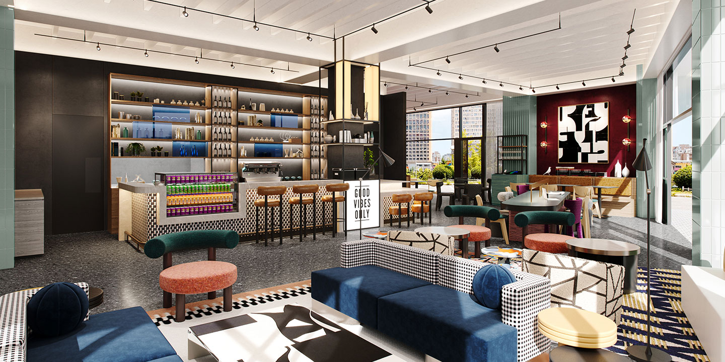 Modern hotel interior with a stylish, open design. Features a bar with stools, shelves of decor, and a sign saying "Good Vibes Only." Bright and inviting atmosphere.