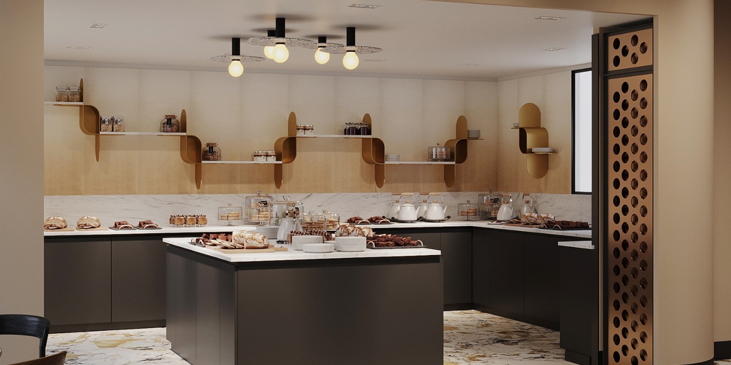 Modern kitchen with marble countertops, floating wooden shelves holding jars, and geometric pendant lights. An island displays assorted baked goods.