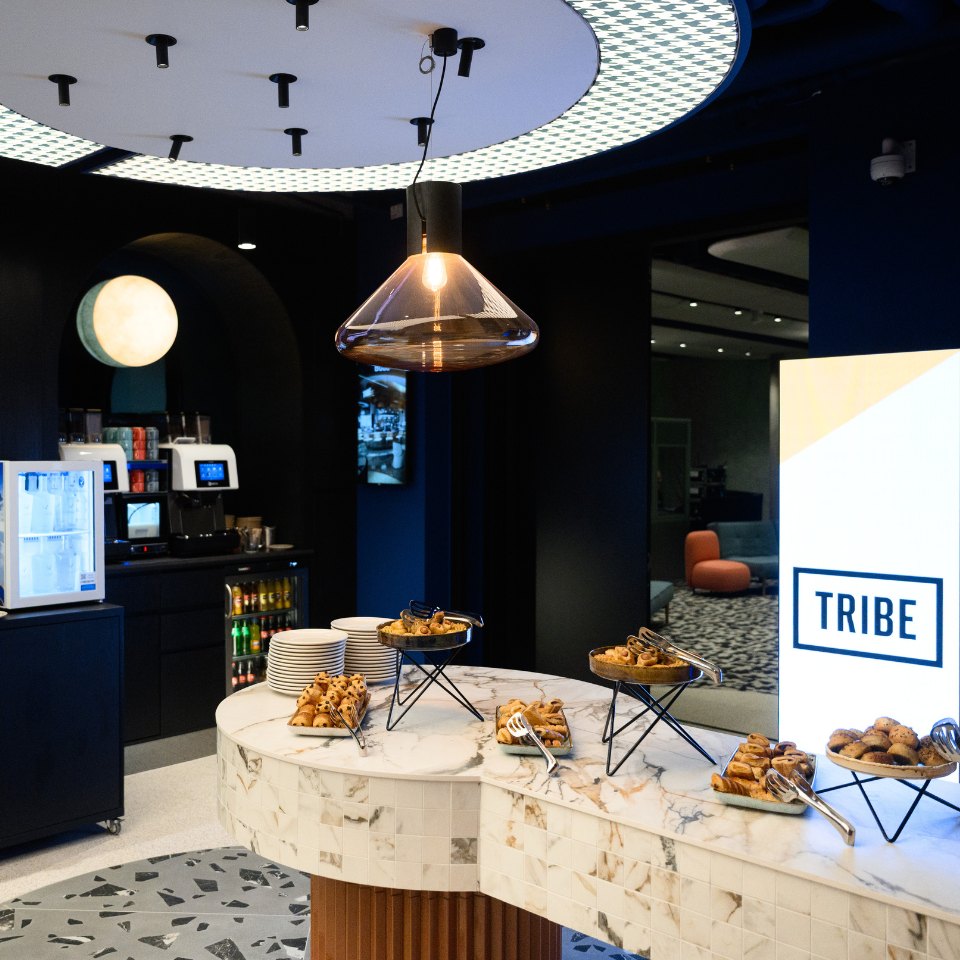 Break buffet with pastries on a marble counter.