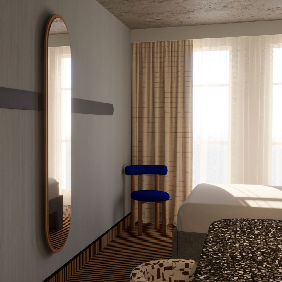 Minimalist bedroom corner with a tall oval mirror, blue chair, bed, patterned carpet, and beige checkered curtains lit by natural light.