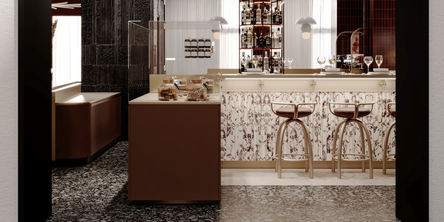 A modern hotel bar featuring a marble-patterned facade, minimalist gold metal bar stools, and a side counter with glass jars filled with cookies on a terrazzo floor.