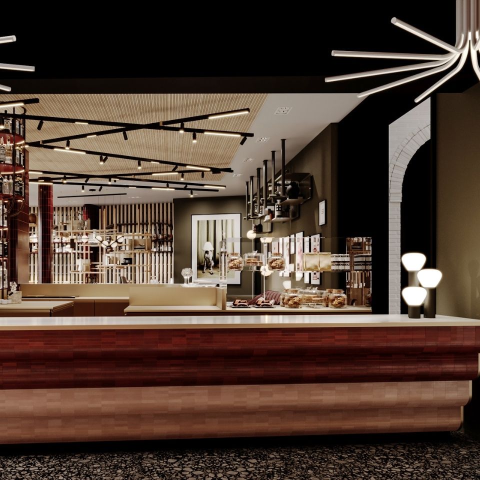 Sleek dark wood and terracotta-finished hotel bar counter with modern table lamps, overlooking a warm, contemporary dining and buffet area.