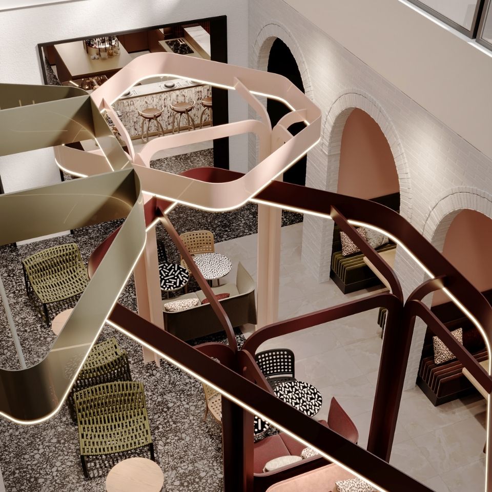 Sculptural ribbons suspended above lounge seating and arched openings.